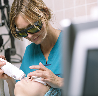 Woman having laser skin treatment